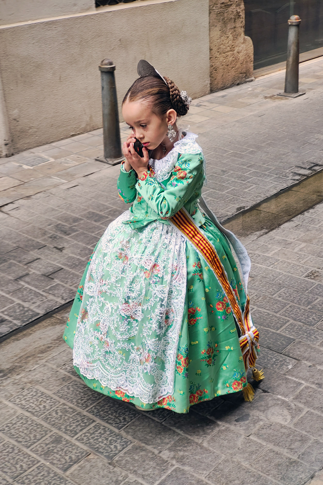 Little Spanish Girl on mobile phone